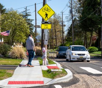 man standing at crosswalk