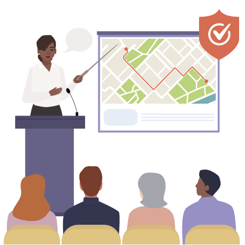 Women pointing out map locations for meeting attendees